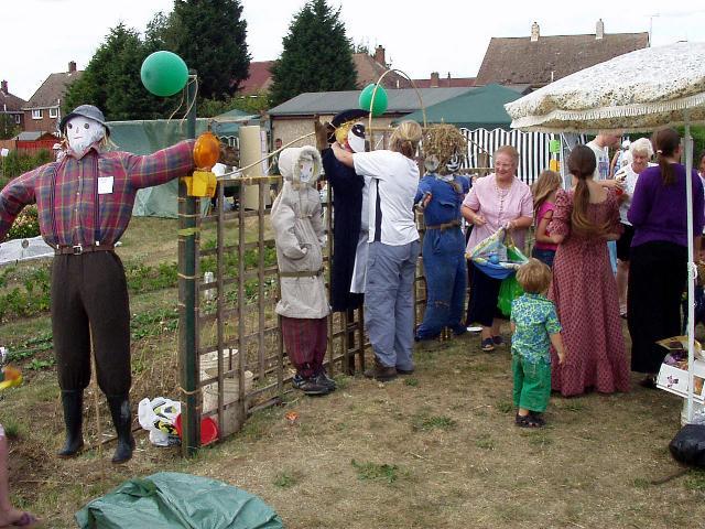 Scarecrows being prepared for judging.