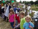 Children admiring scarecrows