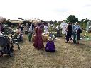 Visitors admiring scarecrows